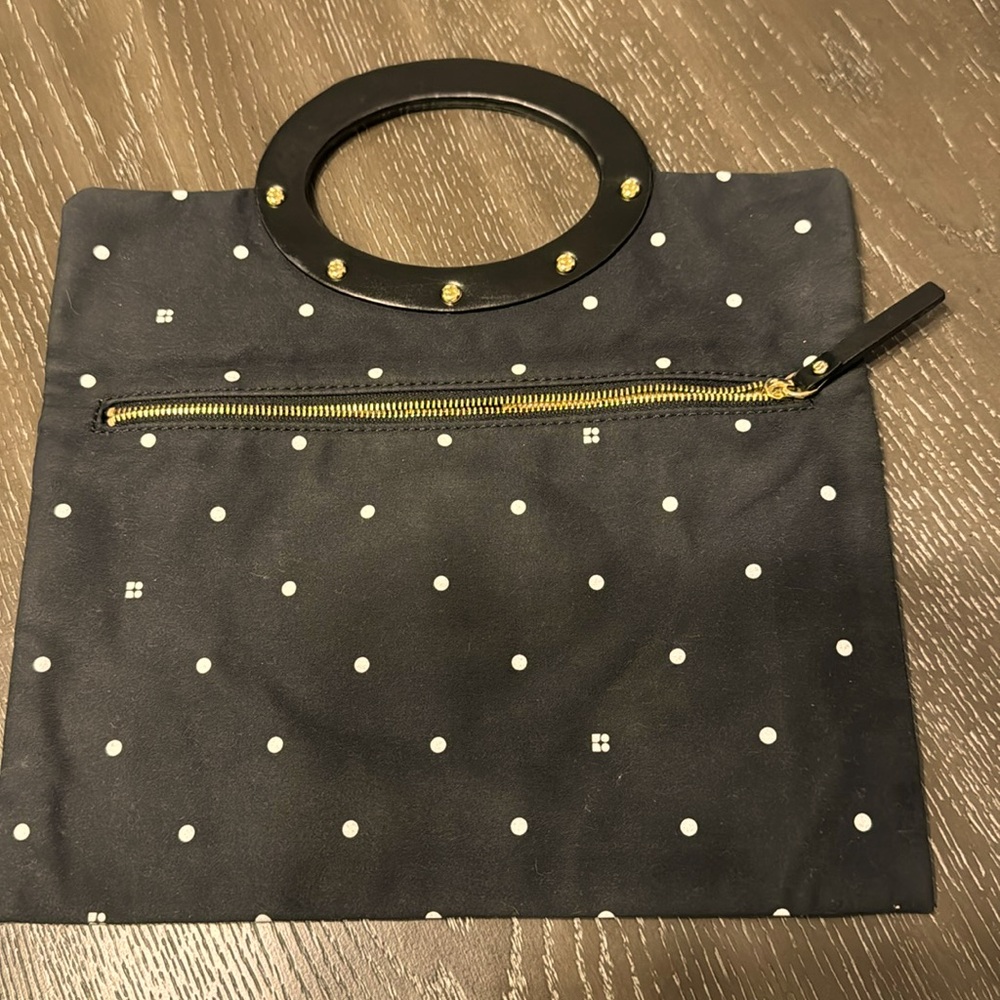 Kate Spade New York small clothe clutch zip closure on front, pre owned
